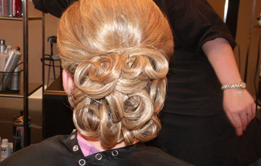fancy hair up-do with blond curls
